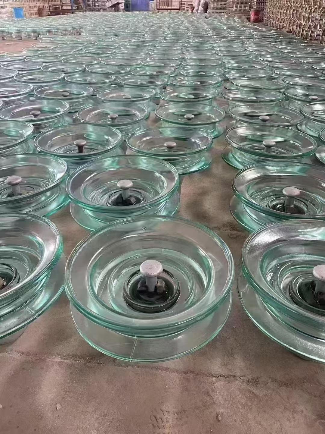 Glass disc insulators in production